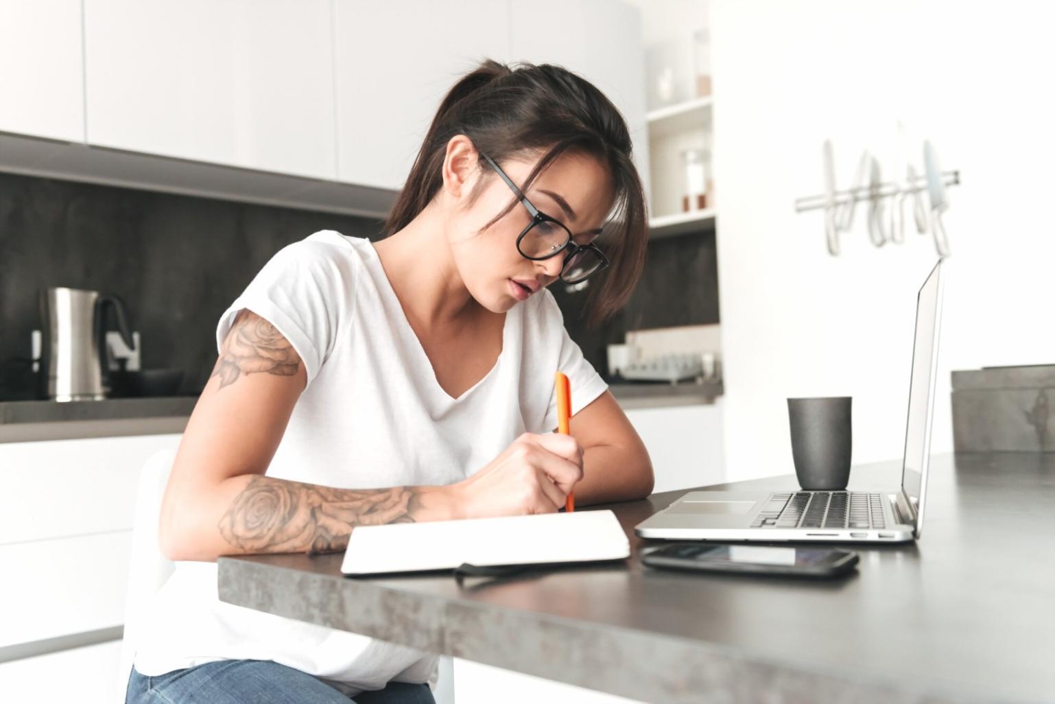 Business mentor reviewing documents with client in professional setting
